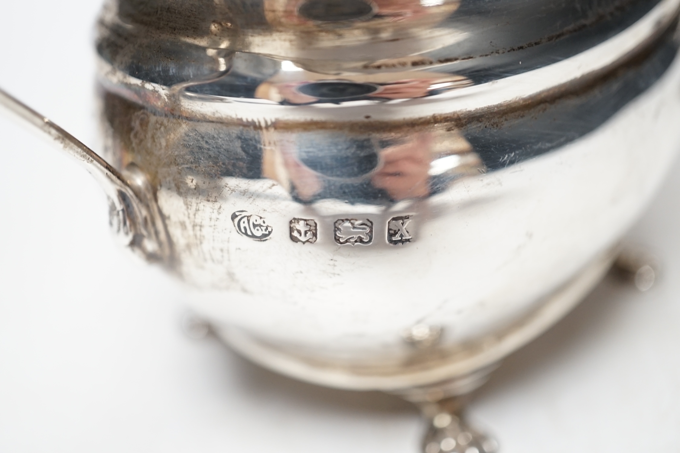 A George V silver cream jug and sugar bowl, by Alexander Clark Co. Ltd, Birmingham, 1922, 13.8oz. Condition - fair to good